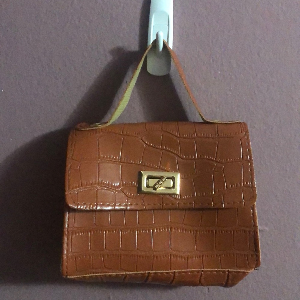 Brown cross body ‘mini bag’.